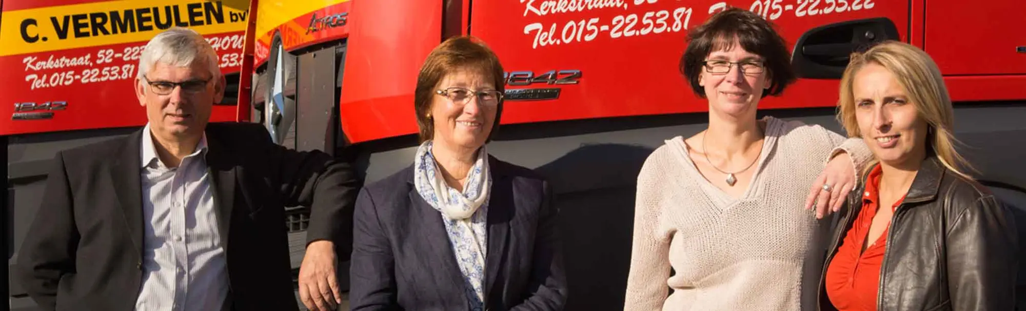The Vermeulen family in front of one of their trucks